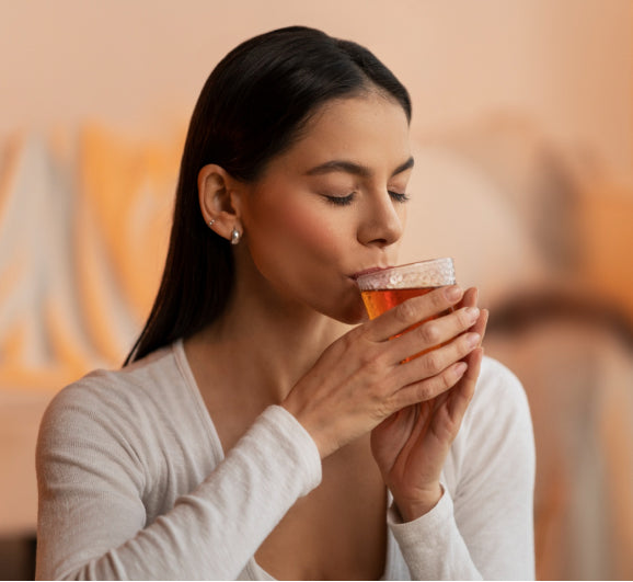 Person enjoying herbal tea